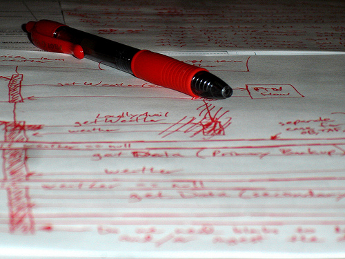 Red pen on paper