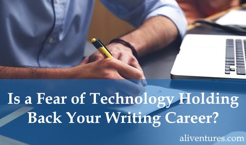 Image shows man writing in notebook, in front of laptop.